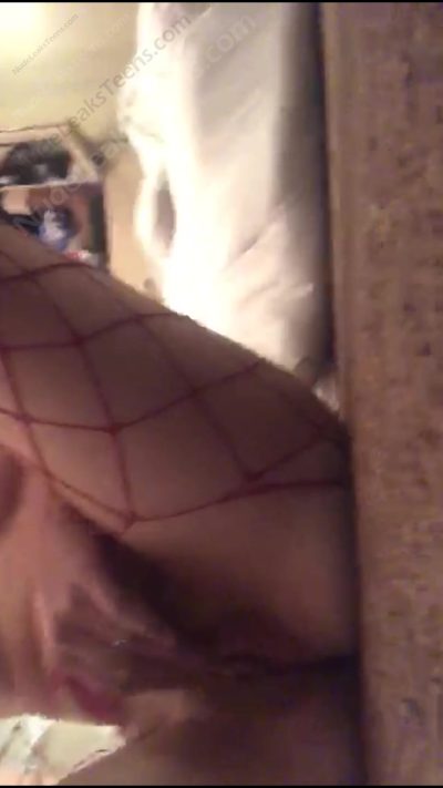 Beth Skeen –  Naughty Girl with red fishnet lays on floor circling her clit