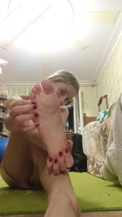 Livia Kristen –  Horny girl lifts her legs showing her feet